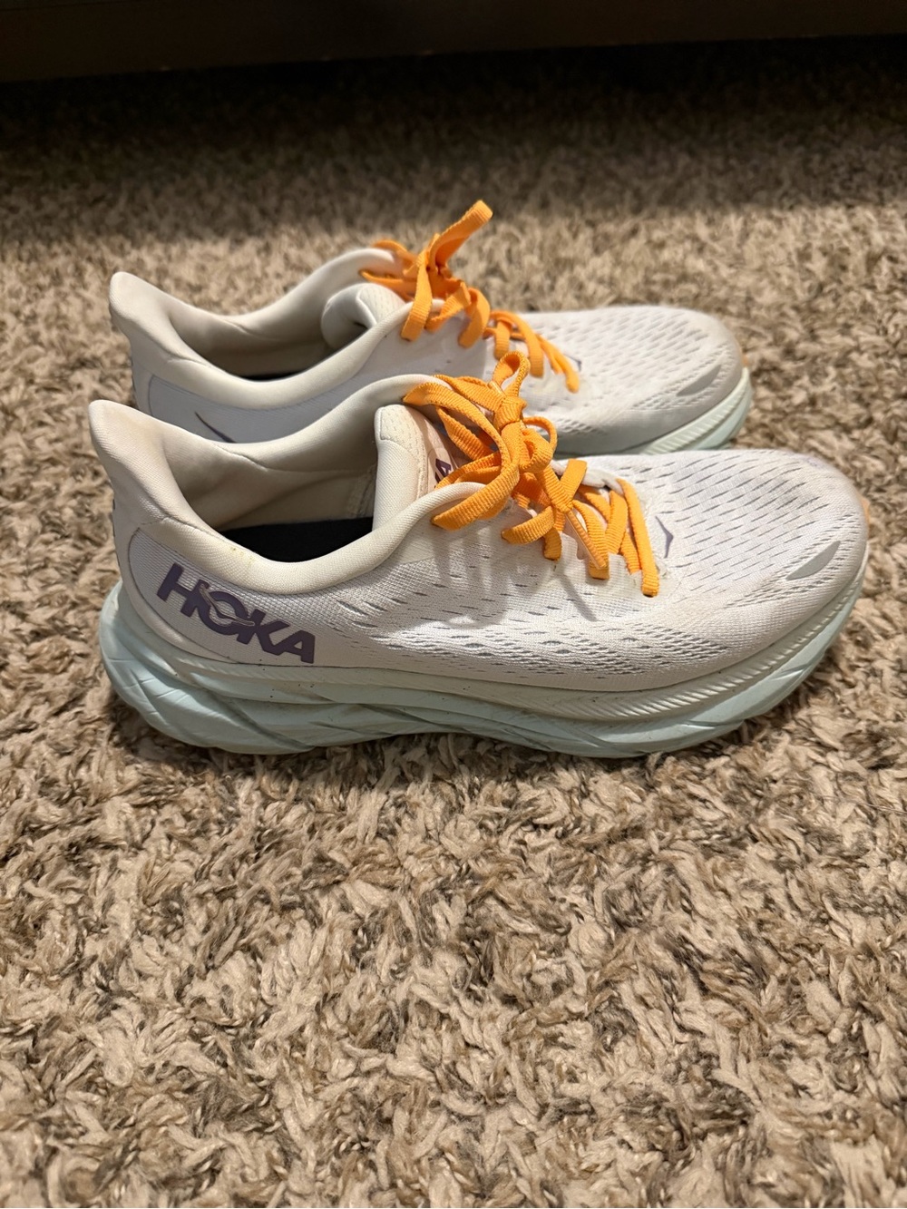 Hoka Women's White Running Shoes with Orange Laces and Lavender Logo